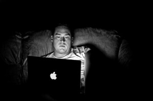 Solitary male on laptop at night